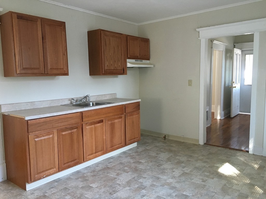 18 Santa Barbara Street Springfield, MA 01104 - Photo 3 of 14 a room with cabinets