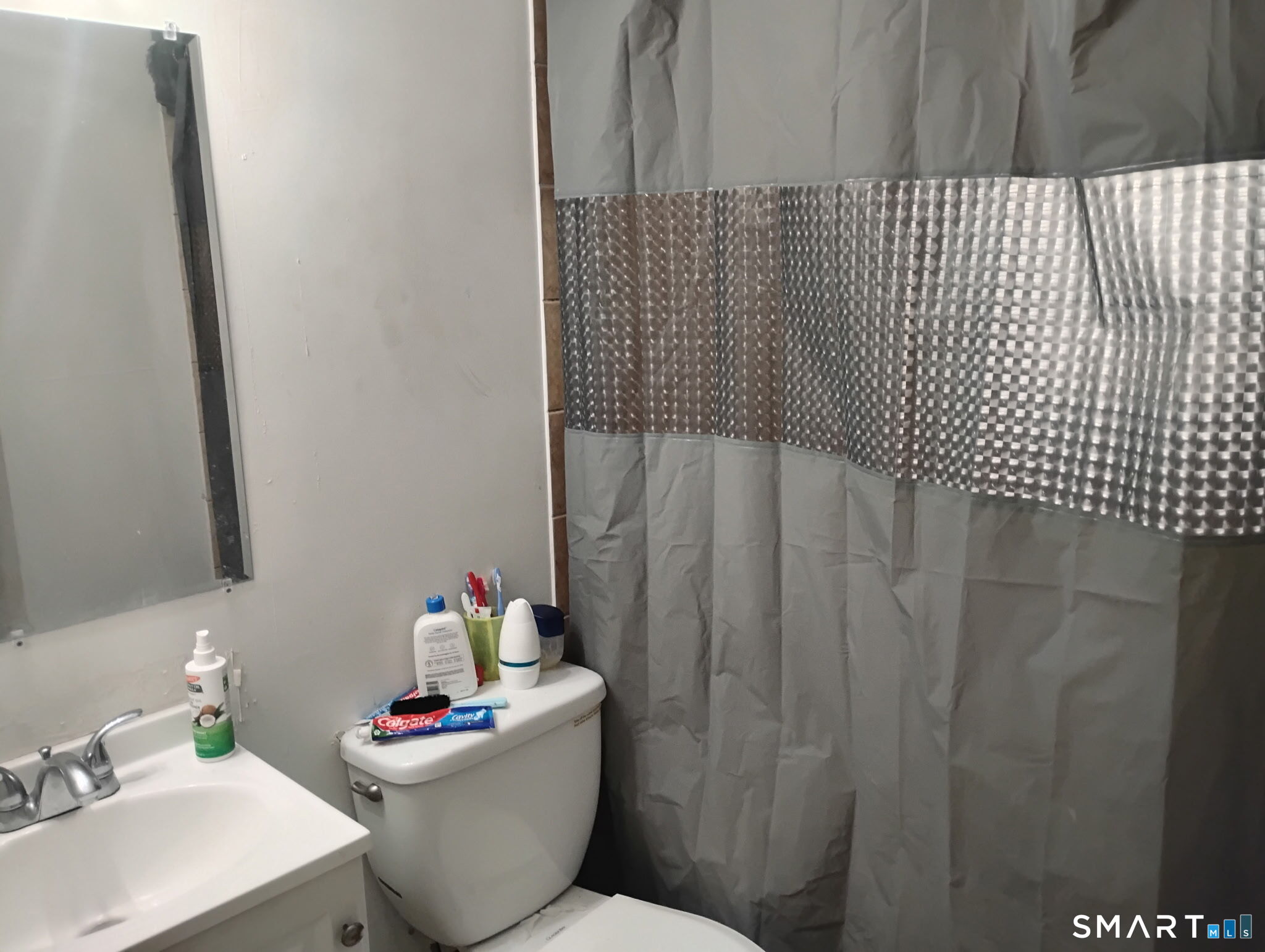 341 Mill Rock Road, Unit 341 Hamden, CT 06517 - Photo 5 of 9 a bathroom with a sink toilet and a shower