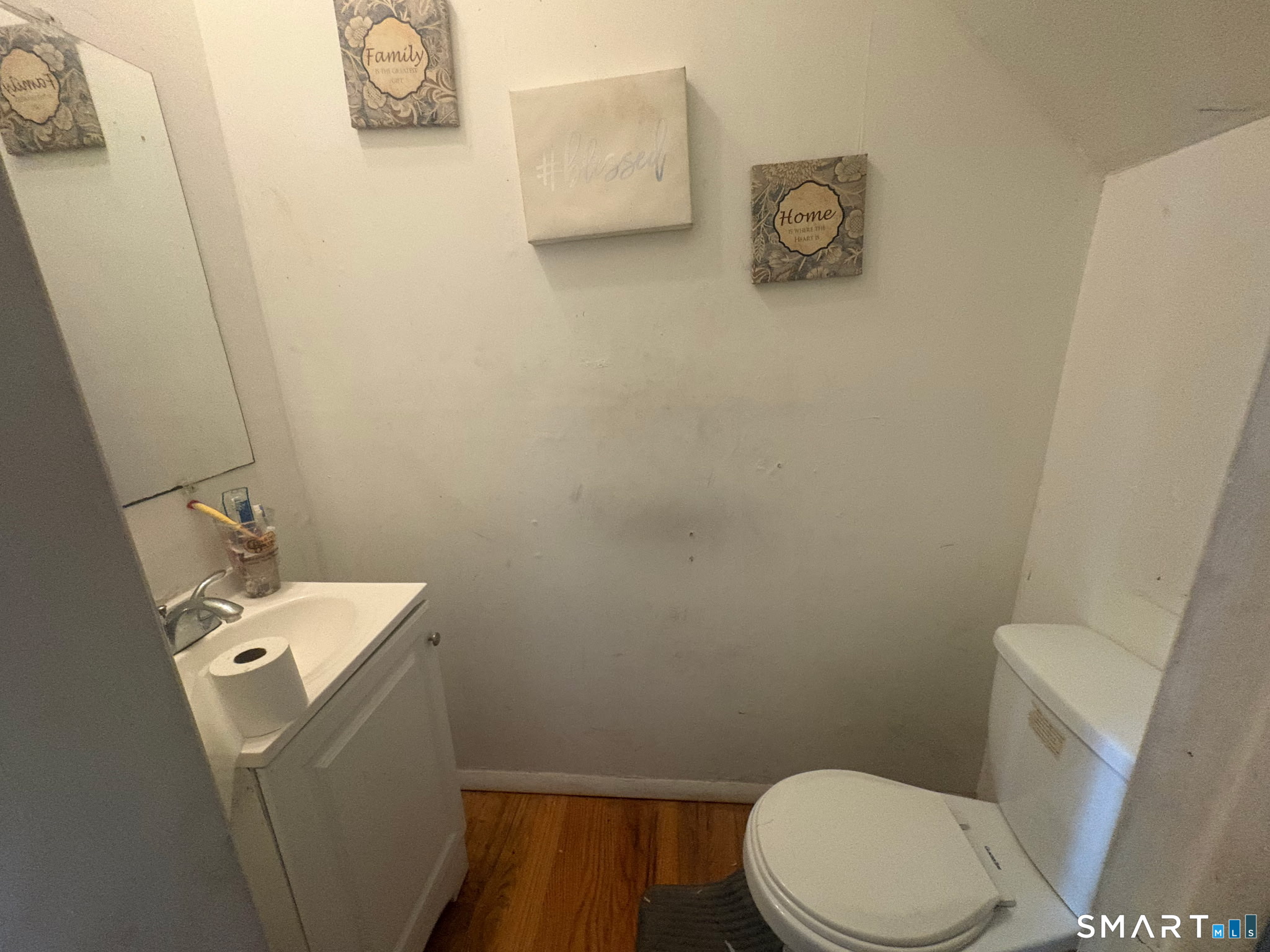 341 Mill Rock Road, Unit 341 Hamden, CT 06517 - Photo 7 of 9 a bathroom with a toilet and a sink