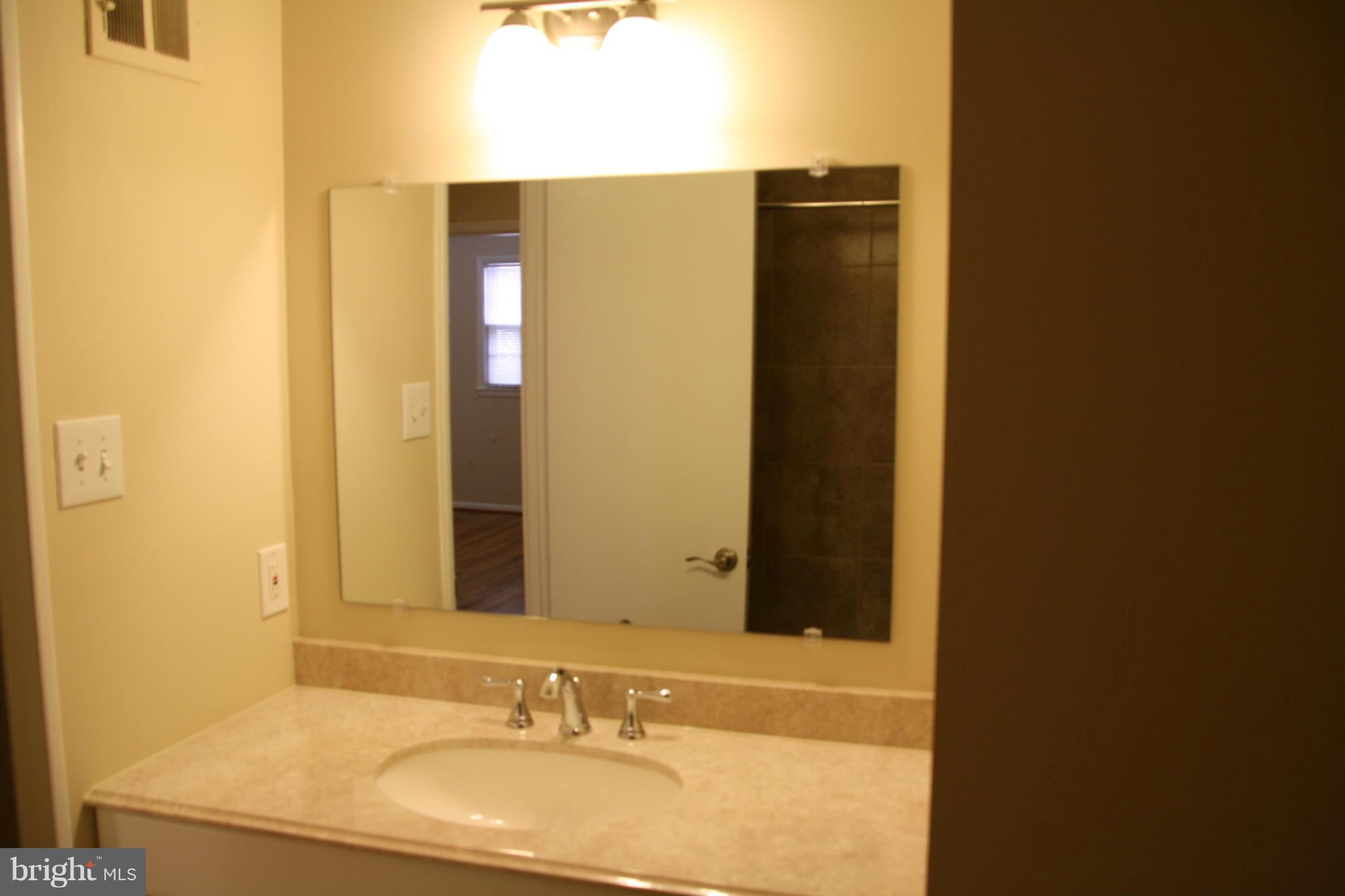 11509 Bucknell Drive Silver Spring, MD 20902 - Photo 15 of 23 Middle Bathroom with New Vanity,Tub,Ceramic