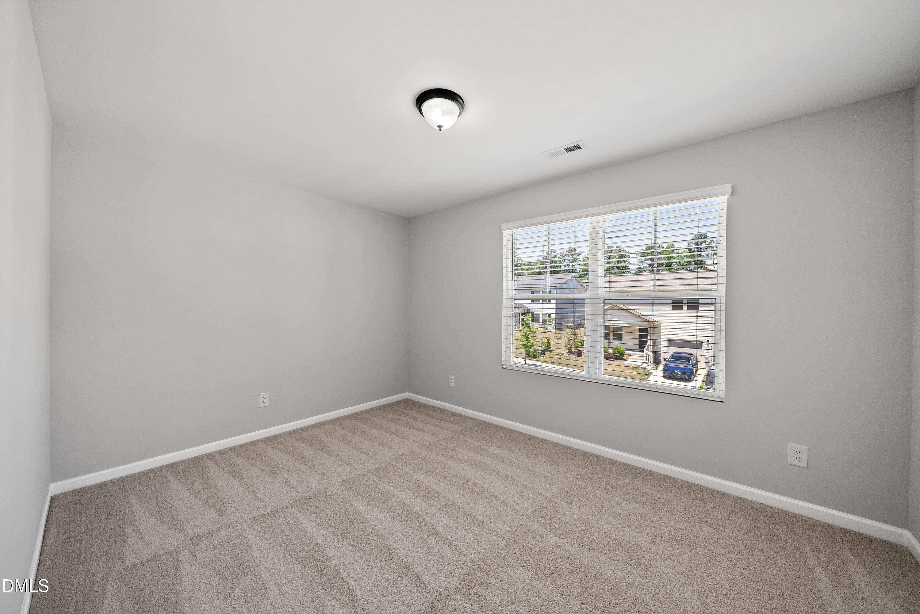 2816 Elsa Drive Raleigh, NC 27610 - Photo 22 of 35 a view of an empty room with a window