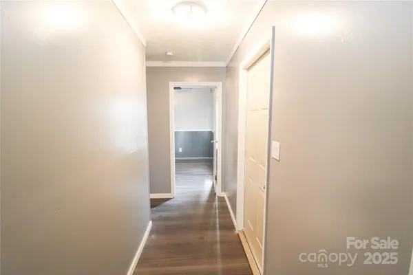 a view of a bathroom from a hallway