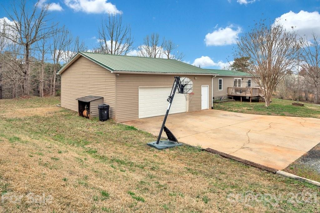 3683 Big Island Road Rutherfordton, NC 28139 - Photo 14 of 41 a view of a house with a yard and garage