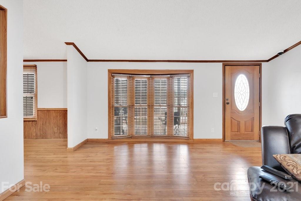 3683 Big Island Road Rutherfordton, NC 28139 - Photo 27 of 41 a view of an empty room with wooden floor and a window