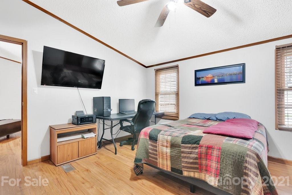 3683 Big Island Road Rutherfordton, NC 28139 - Photo 32 of 41 a bedroom with a bed and a flat screen tv