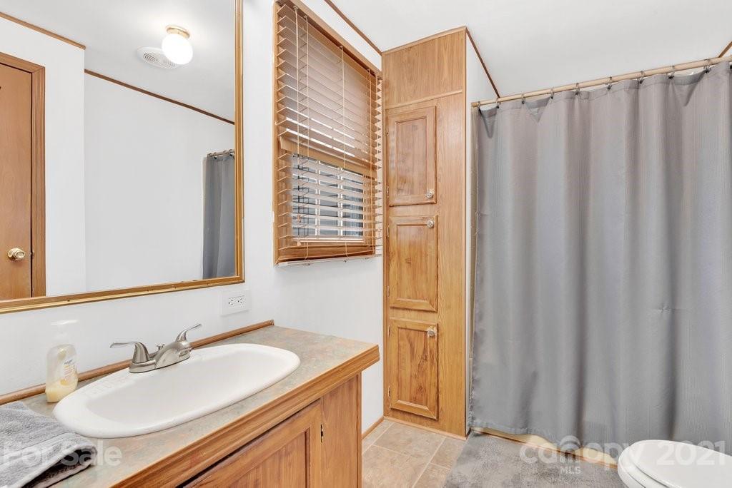 3683 Big Island Road Rutherfordton, NC 28139 - Photo 33 of 41 a bathroom with a sink and a mirror