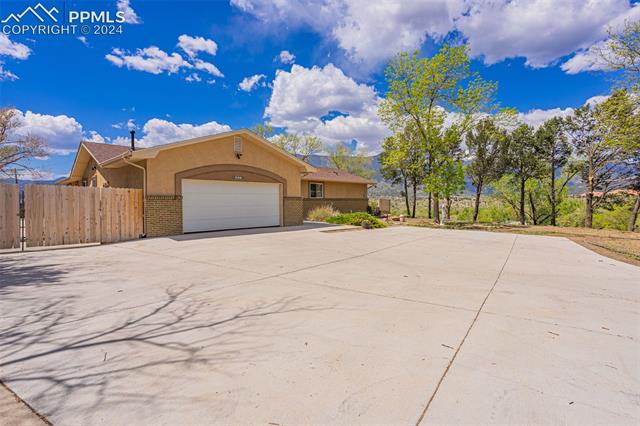 807 Fontmore Road Colorado Springs, CO 80904 - Photo 13 of 50 View of front of property featuring a garage