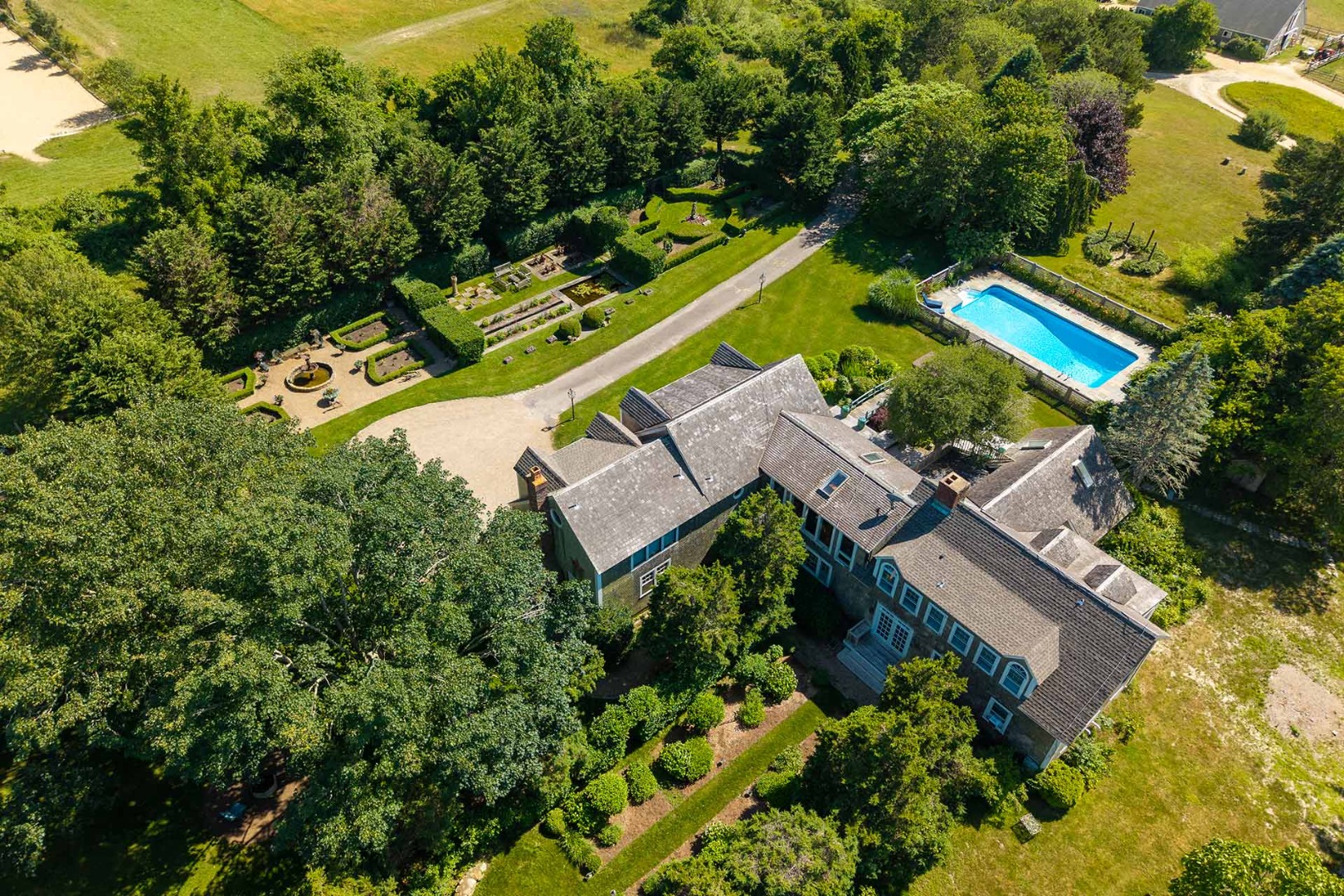 5 Louis Field Road Edgartown, MA 02539 - Photo 11 of 33 an aerial view of a house with a garden and swimming pool