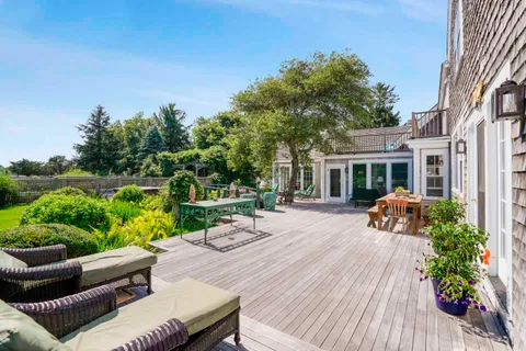 a view of swimming pool with seating space and garden