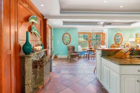 a kitchen with granite countertop cabinets a sink and a window