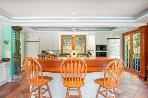a view of a dining room with furniture window and outside view