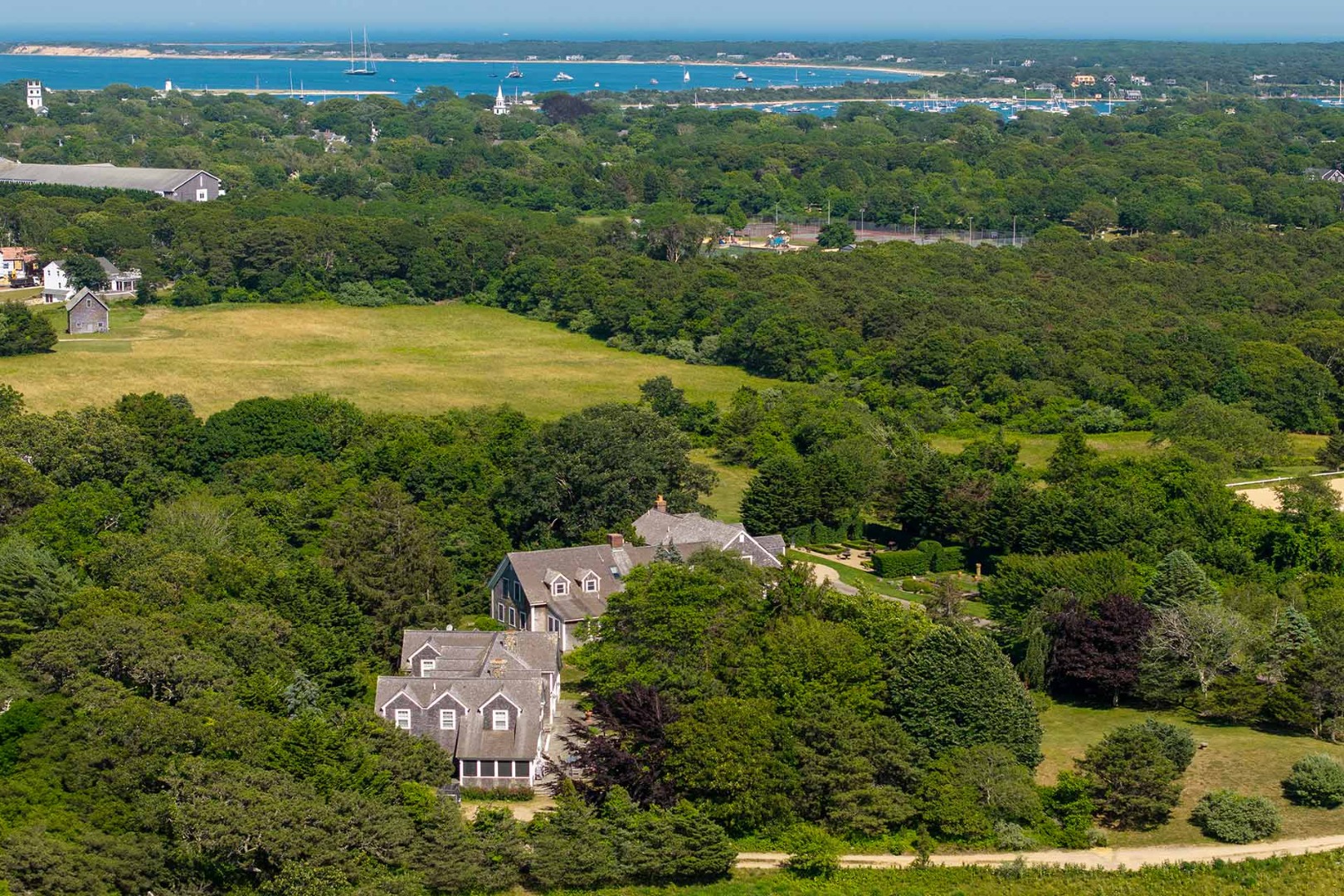 5 Louis Field Road Edgartown, MA 02539 - Photo 4 of 33 an aerial view of residential houses with outdoor space and trees