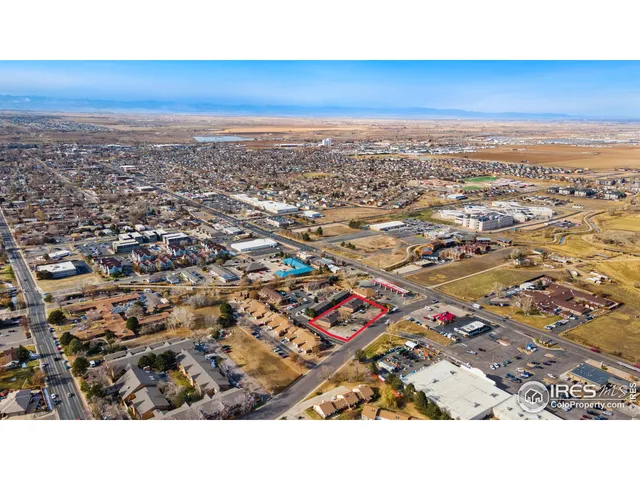 an aerial view of residential building and ocean