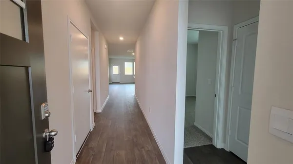 a kitchen with stainless steel appliances granite countertop a sink stove microwave and refrigerator