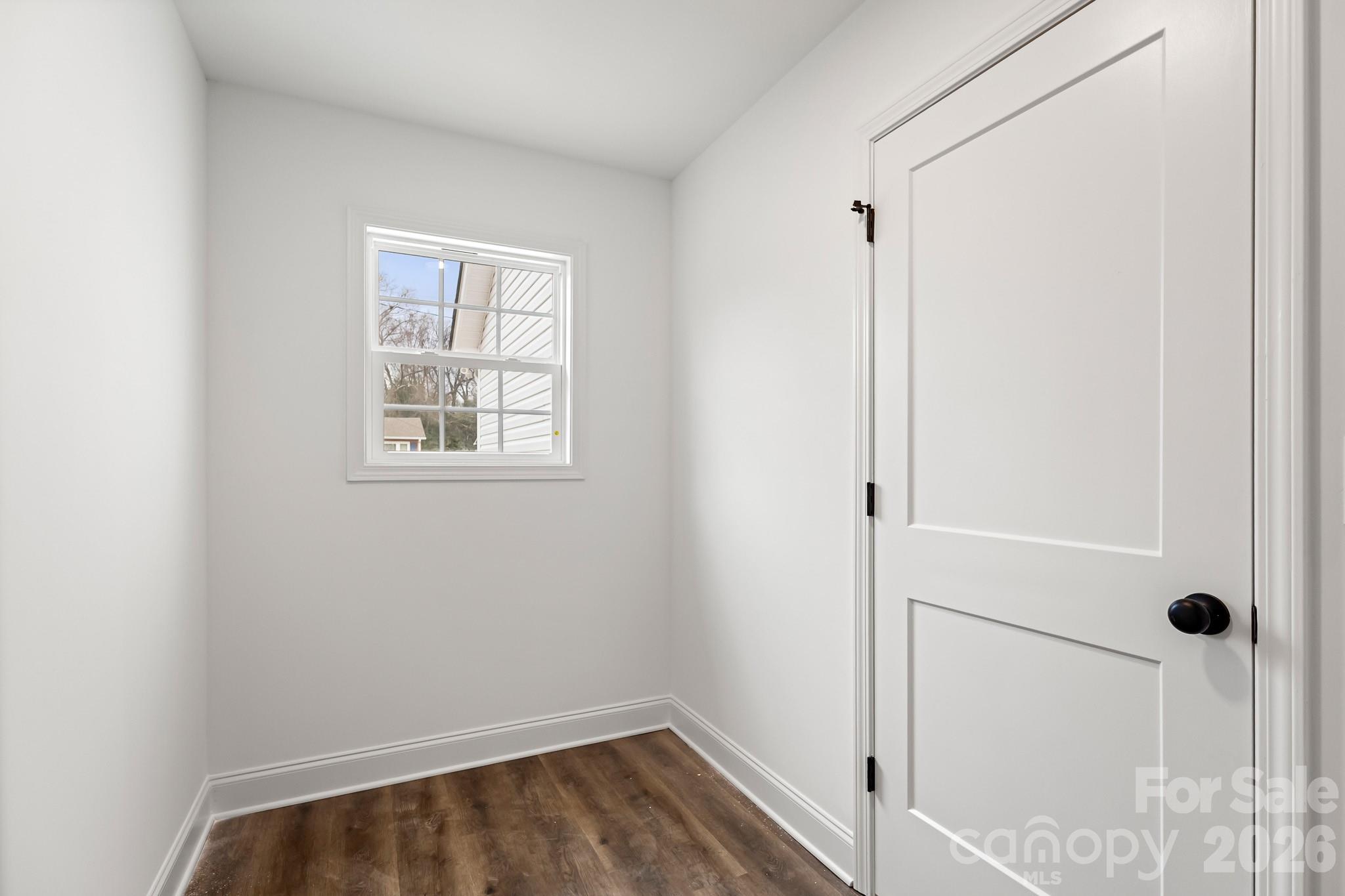 545 Washington Street Rock Hill, SC 29730 - Photo 14 of 29 a view of a room with wooden floor and cabinet