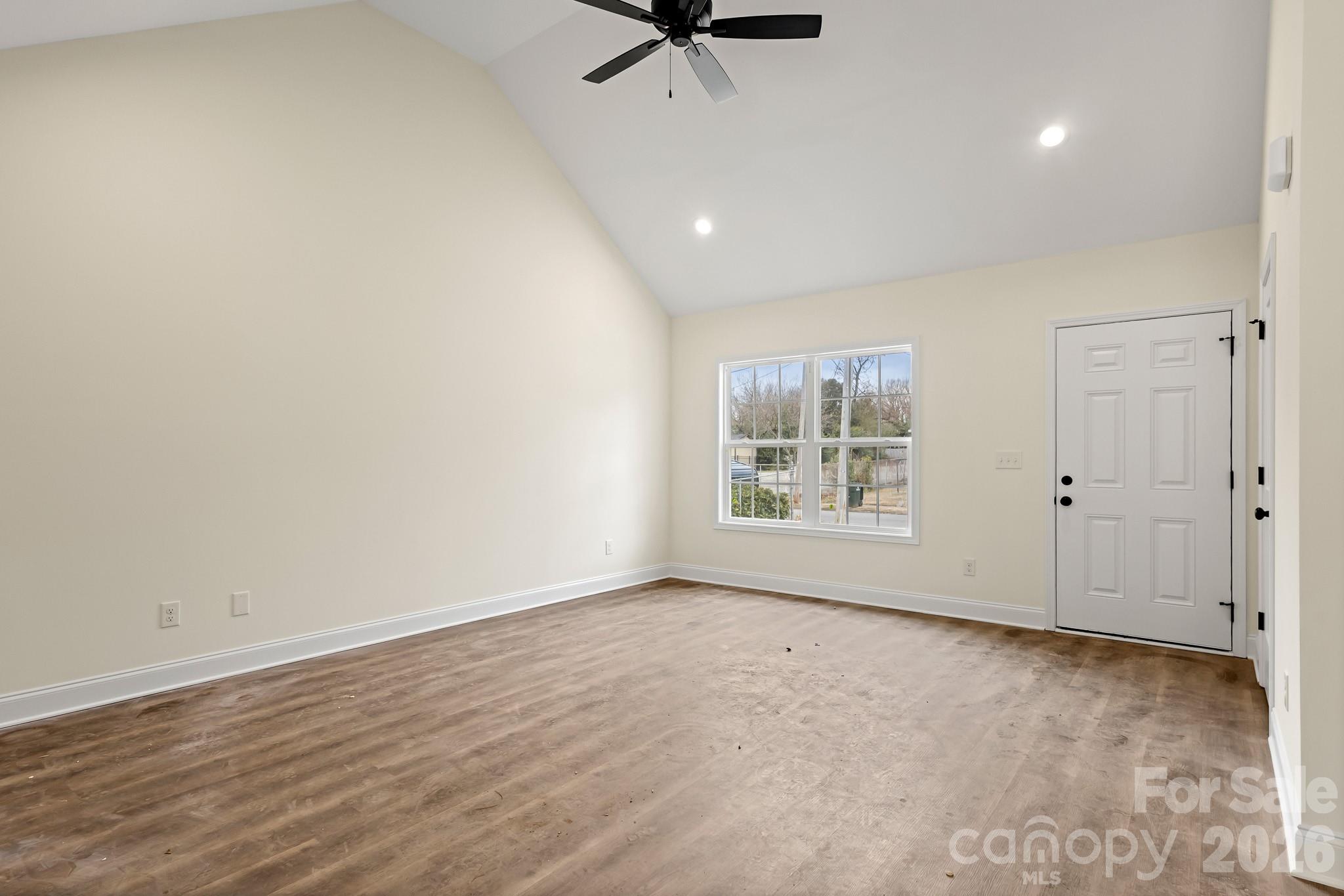 545 Washington Street Rock Hill, SC 29730 - Photo 2 of 29 wooden floor in an empty room with a window