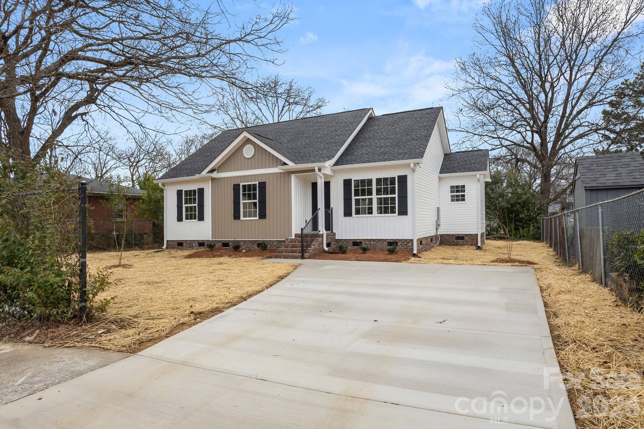 545 Washington Street Rock Hill, SC 29730 - Photo 26 of 29 a front view of a house with a yard and garage