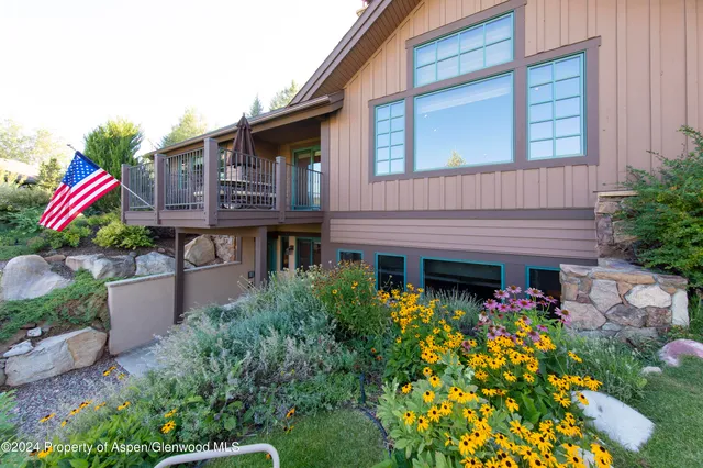 a front view of house with an outdoor seating