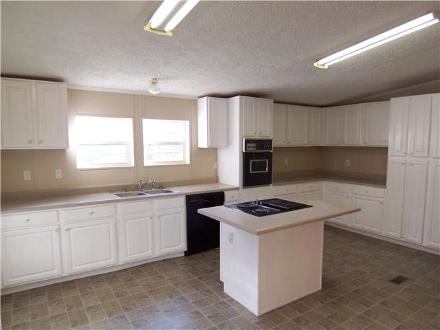 9434 Missionary Ridge Road Bon Aqua, TN 37025 - Photo 5 of 18 a kitchen that has a sink and a stove in it