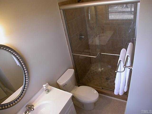 5606 Earl Road Durham, NC 27712 - Photo 3 of 10 a bathroom with a sink and toilet
