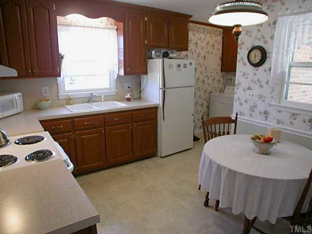 5606 Earl Road Durham, NC 27712 - Photo 5 of 10 a kitchen that has a sink and a stove in it