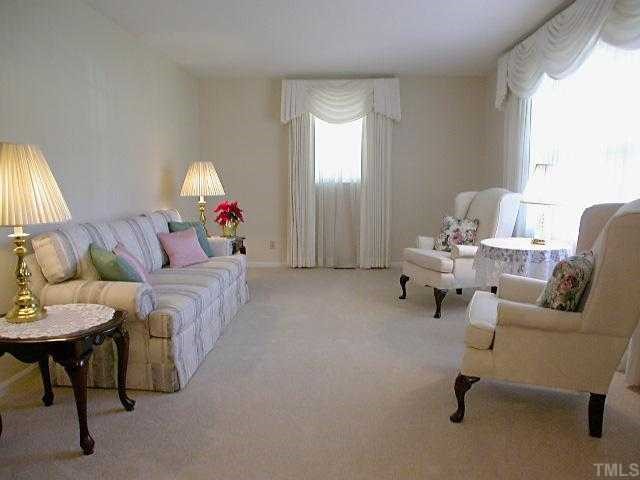 5606 Earl Road Durham, NC 27712 - Photo 6 of 10 a living room with furniture and a lamp