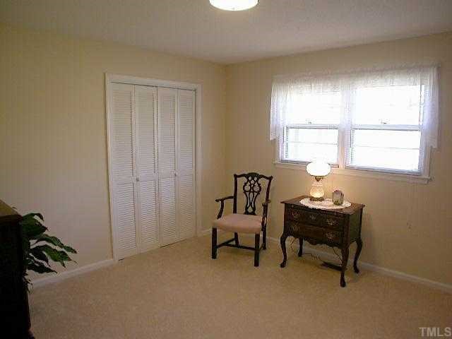 5606 Earl Road Durham, NC 27712 - Photo 7 of 10 a bedroom with a workspace and a window