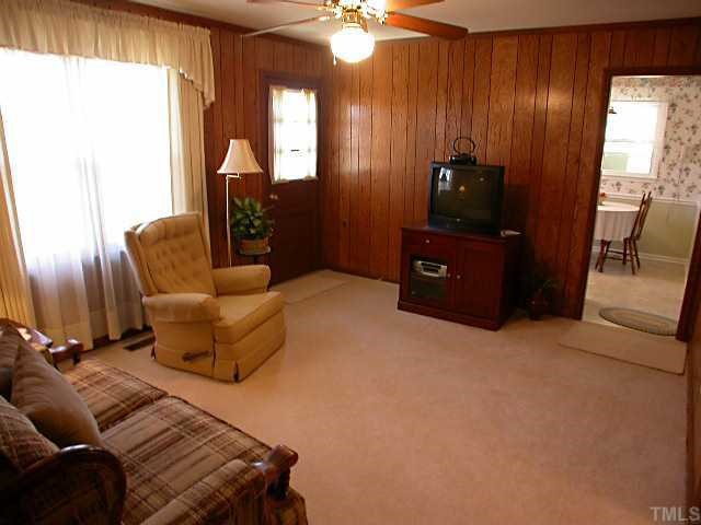 5606 Earl Road Durham, NC 27712 - Photo 9 of 10 a living room with furniture and a flat screen tv
