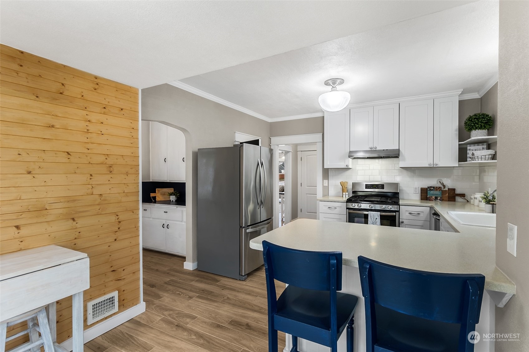 190 Southwest Lewis Street Chehalis, WA 98532 - Photo 16 of 30 a kitchen with stainless steel appliances a sink a stove a refrigerator cabinets and dining table