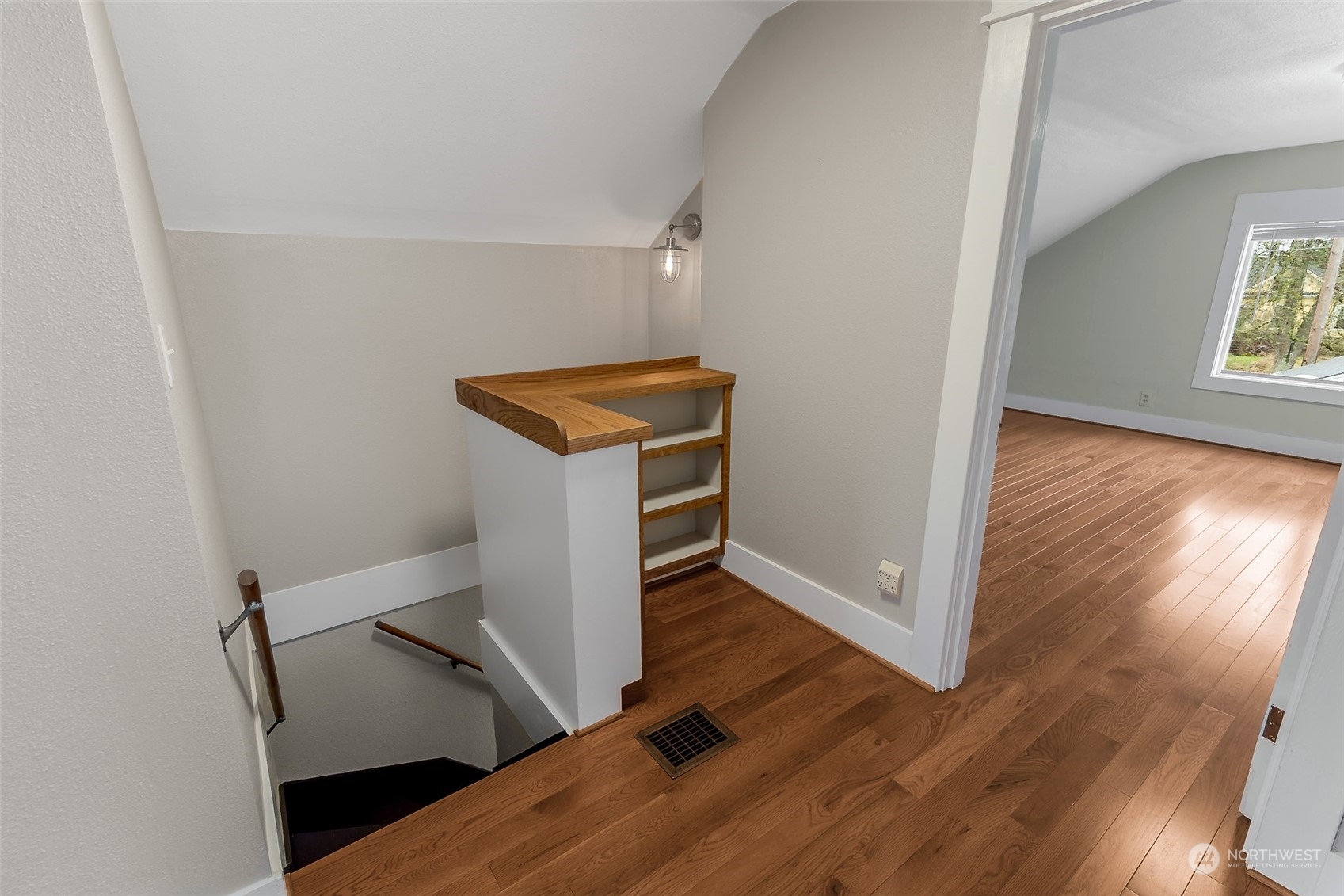 190 Southwest Lewis Street Chehalis, WA 98532 - Photo 21 of 30 an empty room with wooden floor staircase and windows