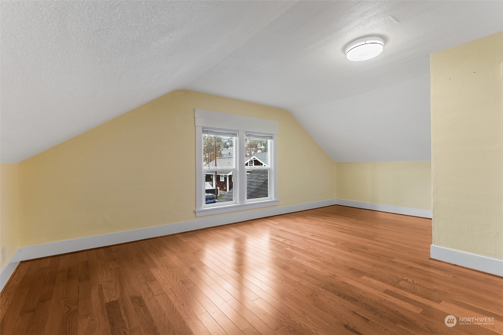 190 Southwest Lewis Street Chehalis, WA 98532 - Photo 24 of 30 a view of an empty room with wooden floor and a window