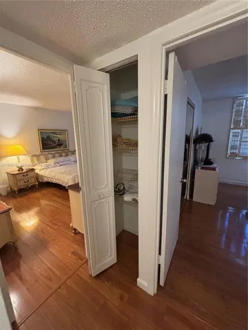 a view of a living room and hardwood floor
