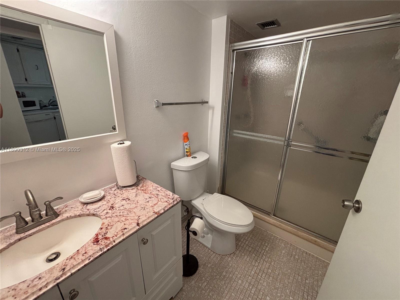 6901 Environ Boulevard, Unit 3F Lauderhill, FL 33319 - Photo 8 of 16 a bathroom with a sink and a mirror