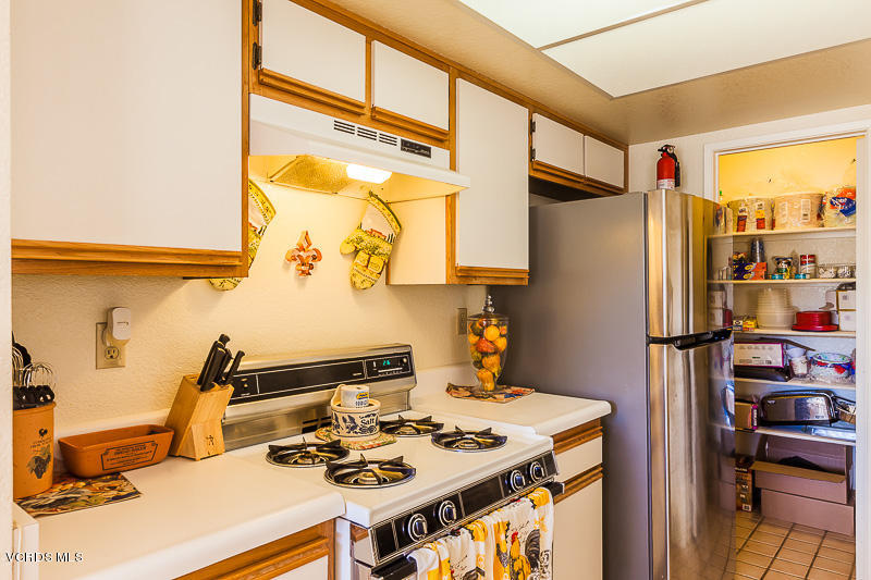 1225 Fitzgerald Road, Unit B Simi Valley, CA 93065 - Photo 15 of 34 a kitchen with stainless steel appliances granite countertop a refrigerator and a stove
