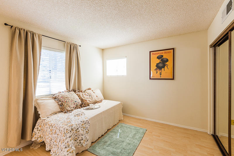 1225 Fitzgerald Road, Unit B Simi Valley, CA 93065 - Photo 19 of 34 a living room with furniture and a window