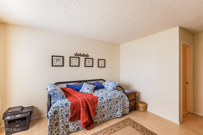 1225 Fitzgerald Road, Unit B Simi Valley, CA 93065 - Photo 24 of 34 a bedroom with a bed and a window