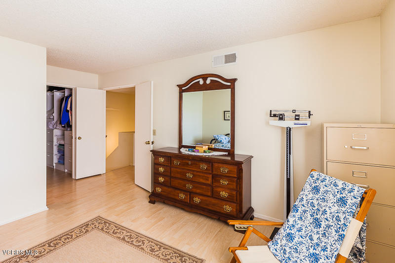 1225 Fitzgerald Road, Unit B Simi Valley, CA 93065 - Photo 25 of 34 a living room with furniture and a mirror