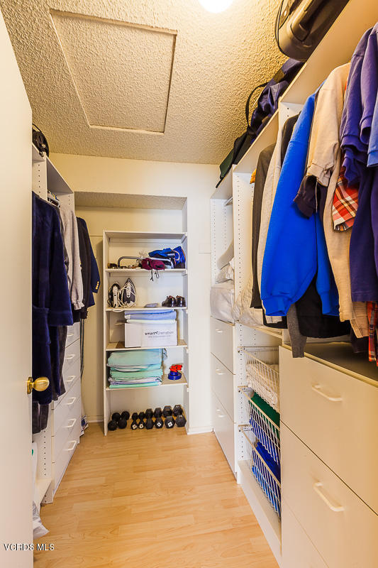 1225 Fitzgerald Road, Unit B Simi Valley, CA 93065 - Photo 28 of 34 a view of walk in closet with clothes and shoes