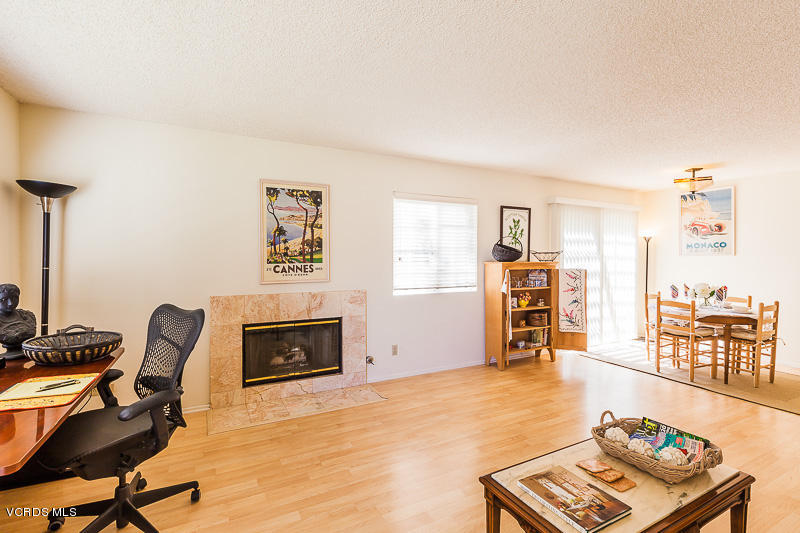 1225 Fitzgerald Road, Unit B Simi Valley, CA 93065 - Photo 5 of 34 a living room with furniture and a flat screen tv