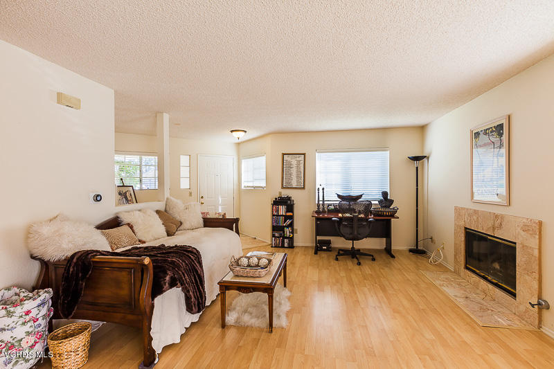 1225 Fitzgerald Road, Unit B Simi Valley, CA 93065 - Photo 8 of 34 a bedroom with furniture and a fireplace