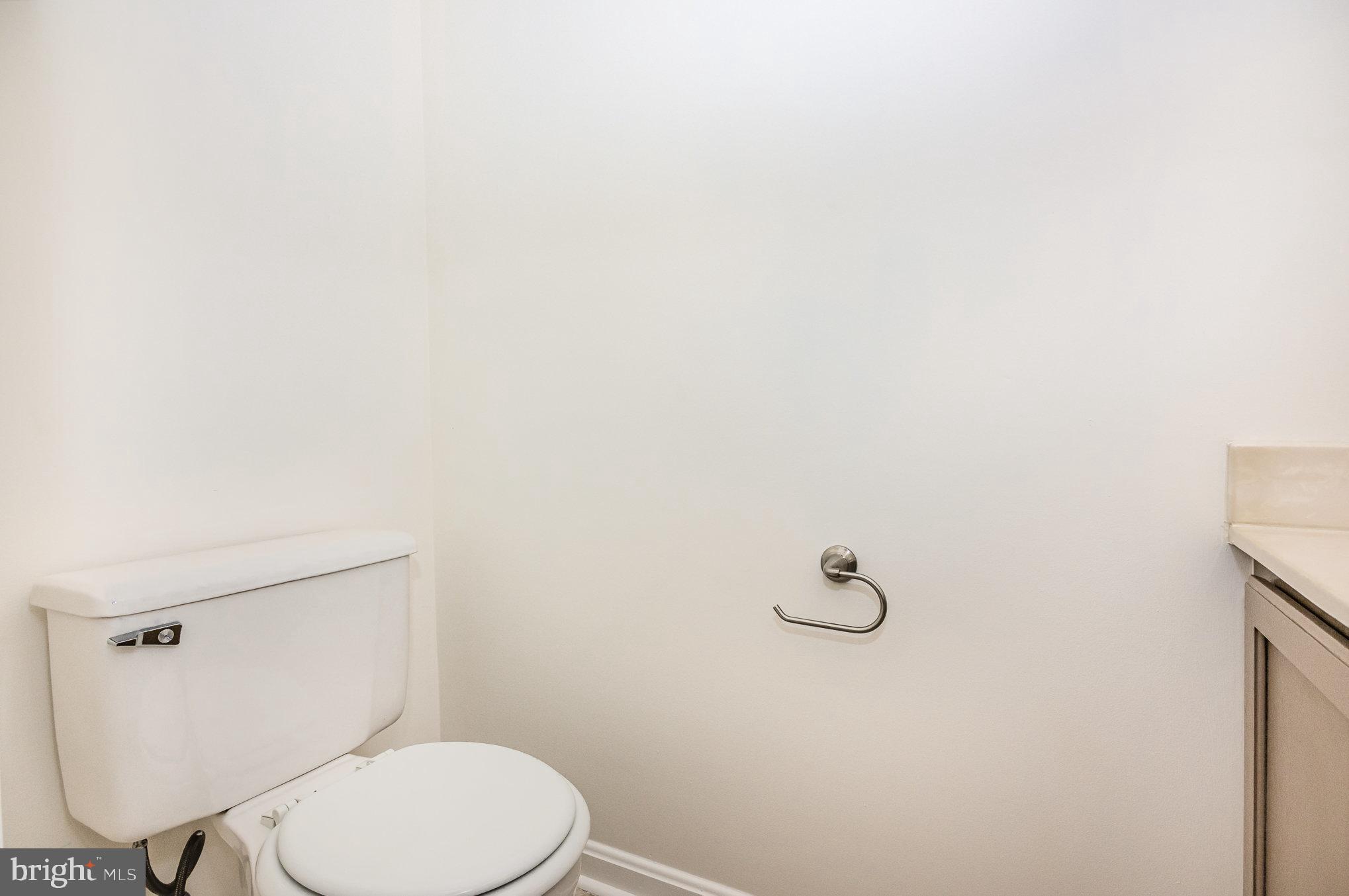 107 Wimbeldon Court Stafford, VA 22556 - Photo 11 of 32 a white toilet sitting next to a shower