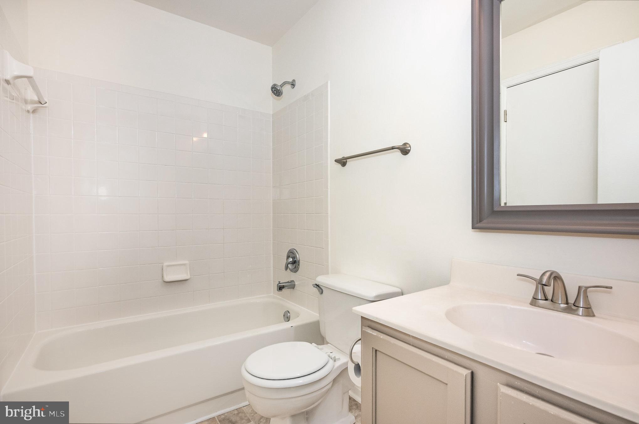 107 Wimbeldon Court Stafford, VA 22556 - Photo 15 of 32 a bathroom with a sink toilet vanity and shower