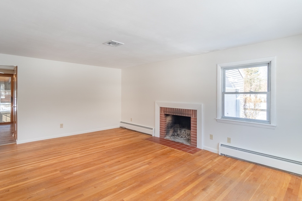 50 Oak Road Longmeadow, MA 01106 - Photo 13 of 37 an empty room with windows and fireplace