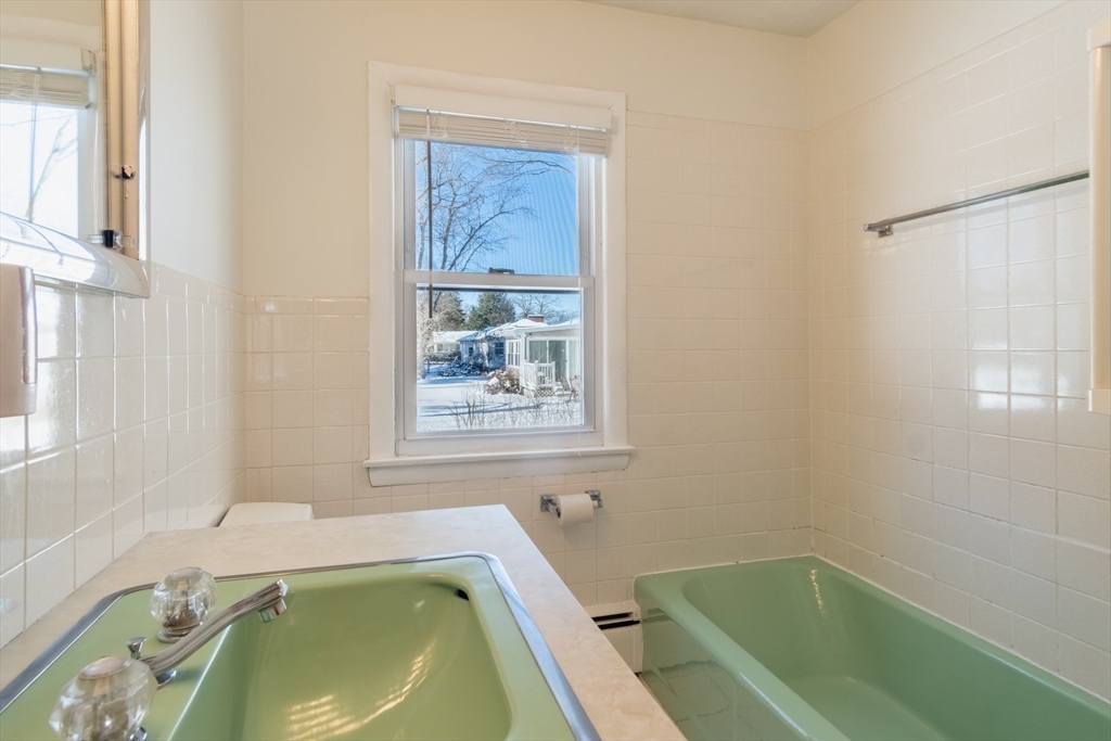 50 Oak Road Longmeadow, MA 01106 - Photo 15 of 37 a bathroom with a tub sink and window
