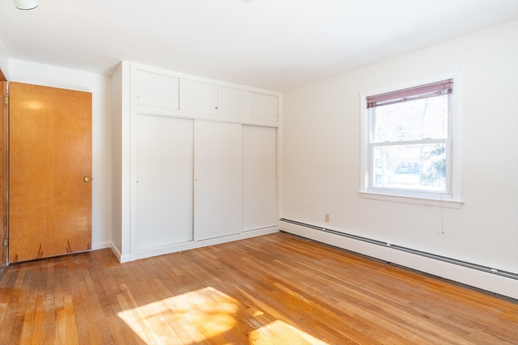 50 Oak Road Longmeadow, MA 01106 - Photo 17 of 37 an empty room with wooden floor closet and windows
