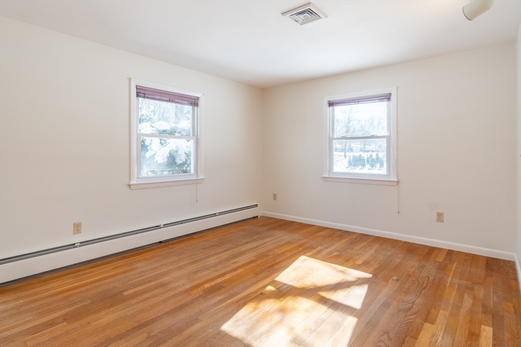 50 Oak Road Longmeadow, MA 01106 - Photo 19 of 37 a view of an empty room with wooden floor and a window