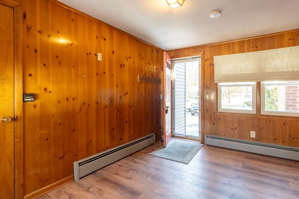 50 Oak Road Longmeadow, MA 01106 - Photo 3 of 37 a view of an empty room with wooden floor and a window