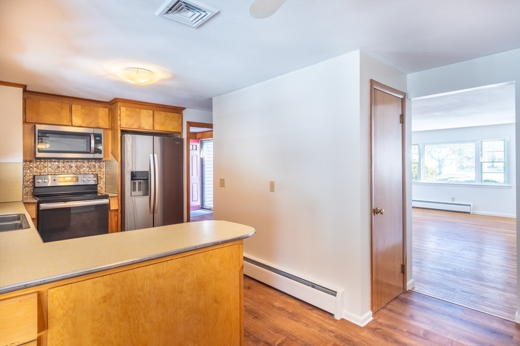 50 Oak Road Longmeadow, MA 01106 - Photo 8 of 37 a kitchen with stainless steel appliances a refrigerator and microwave