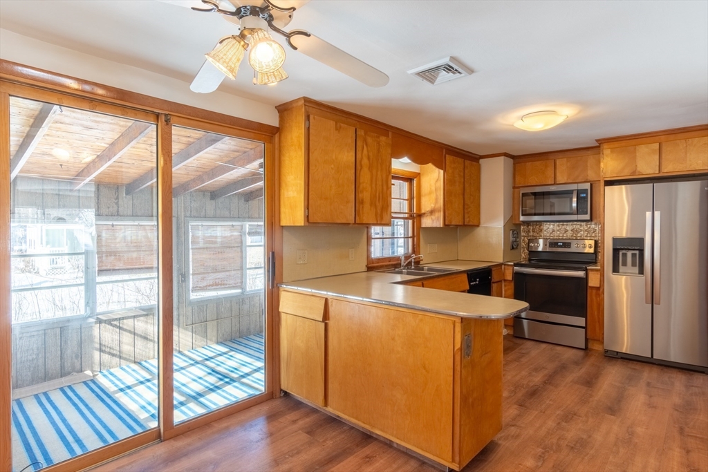 50 Oak Road Longmeadow, MA 01106 - Photo 9 of 37 a kitchen with stainless steel appliances a refrigerator a sink appliances and a large window