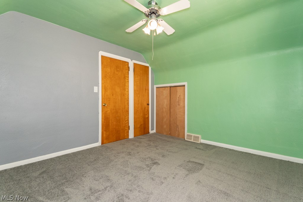 4210 Redfern Road Parma, OH 44134 - Photo 21 of 46 Empty room with carpet floors, lofted ceiling, and ceiling fan